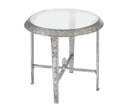 AN ART DECO CAST STEEL AND GLASS CIRCULAR LOW TABLE,