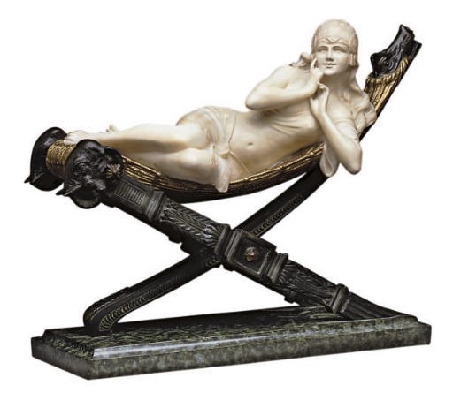 A CONTINENTAL BRONZE AND ALABASTER GROUP OF A RECLINING HAREM GIRL,