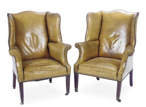 A PAIR OF GEORGE III MAHOGANY AND LEATHER UPHOLSTERED WINGBACK ARMCHAIRS,