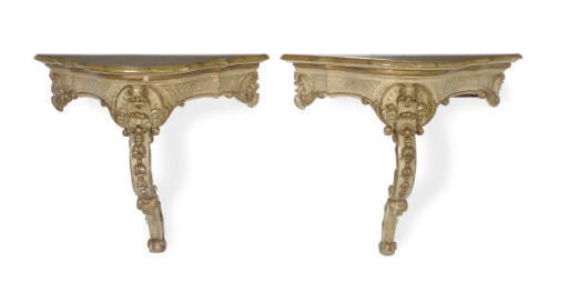 A PAIR OF ITALIAN CREAM-PAINTED AND PARCEL-GILT CONSOLES,