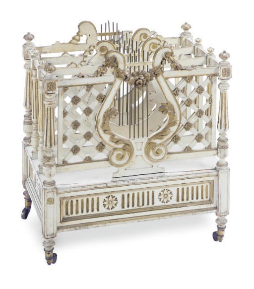 A VICTORIAN CREAM-PAINTED AND PARCEL-GILT CANTERBURY,