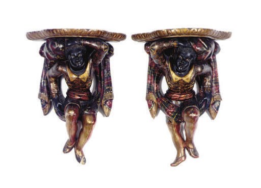 A PAIR OF POLYCHROME-PAINTED FIGURAL 'BLACKAMOOR' WALL BRACKETS,