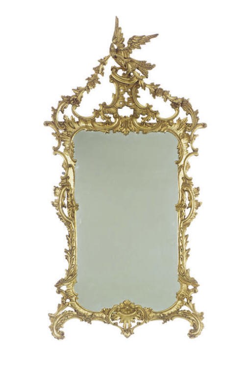 A GILTWOOD WALL MIRROR,