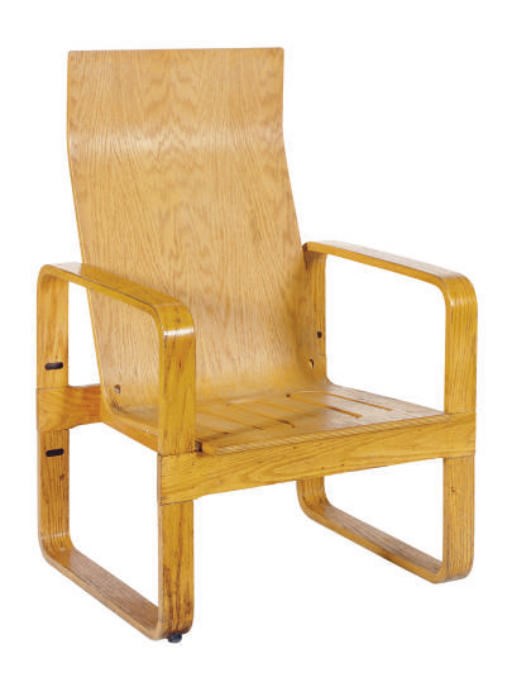 A LAMINATED OAK ARMCHAIR,
