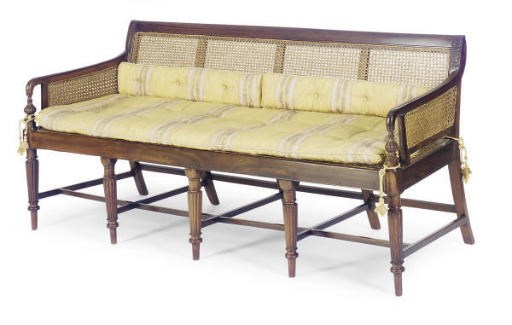 AN ANGLO-INDIAN ROSEWOOD AND CANED SETTEE**,