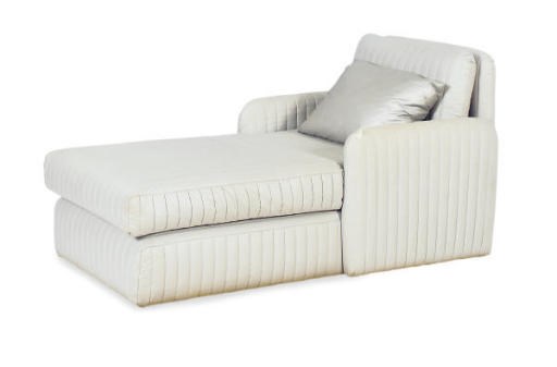 A QUILTED CHAISE LOUNGE,