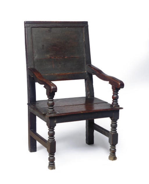 A CONTINENTAL OAK ARMCHAIR,