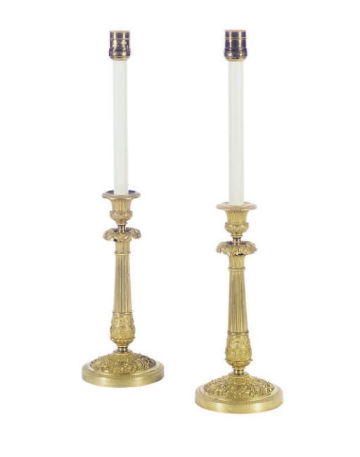 A PAIR OF ENGLISH ORMOLU CANDLESTICKS MOUNTED AS TABLE LAMPS,