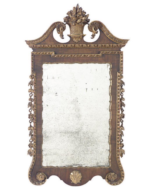 AN ENGLISH WALNUT AND PARCEL-GILT MIRROR,