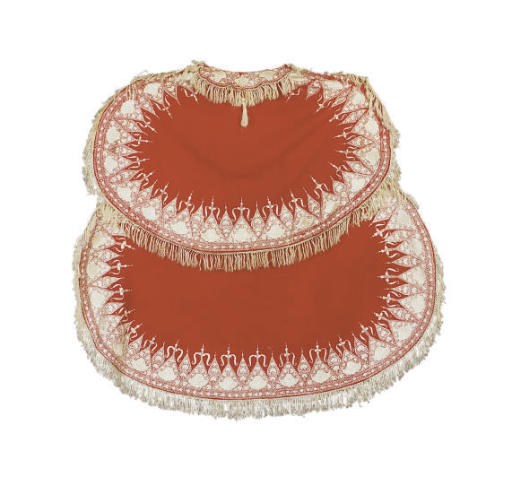 A RED WOOL AND WHITE EMBROIDERED BURNOOSE CAPE,