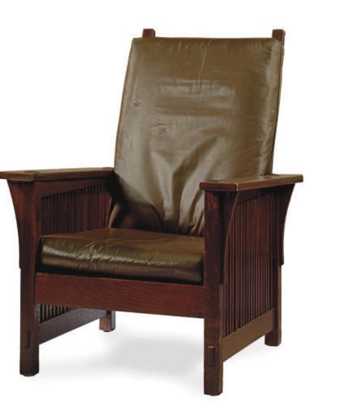 AN OAK RECLINING CHAIR,