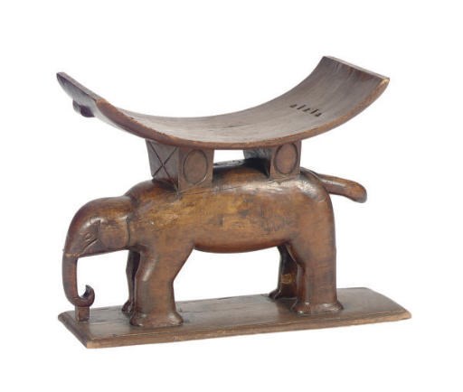AN AFRICAN HARDWOOD FIGURAL STOOL,
