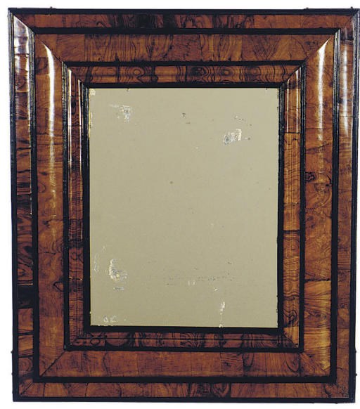 A DUTCH WALNUT AND PART-EBONIZED WALL MIRROR,