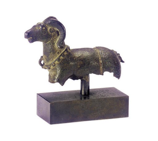 A BRONZE FIGURE OF A RAM,