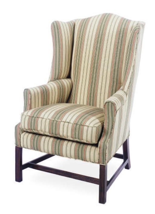 AN ENGLISH MAHOGANY AND UPHOLSTERED WINGBACK ARMCHAIR,