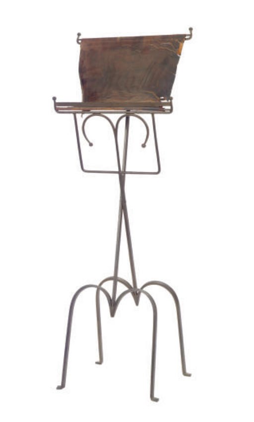 A BRONZED METAL AND LEATHER MUSIC STAND,