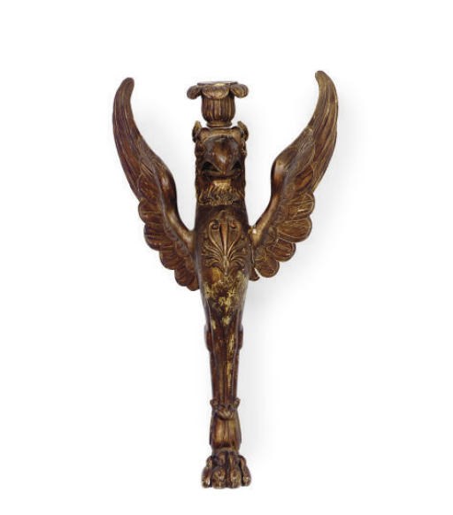 A GILTWOOD ARCHITECTURAL ELEMENT OF A WINGED GRIFFIN,