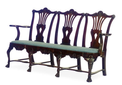 AN IRISH MAHOGANY TRIPLE-CHAIR BACK SETTEE,
