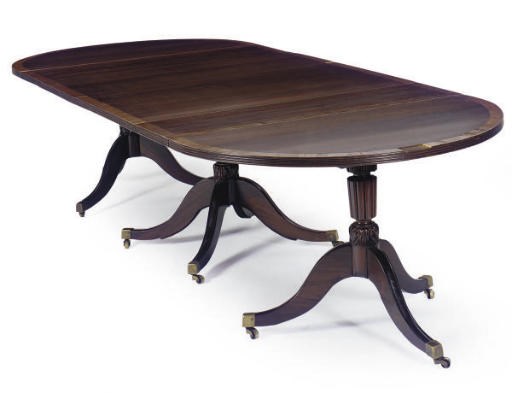 AN ENGLISH MAHOGANY AND DROSSBANDED D-END TRIPLE PEDESTAL DINING TABLE,