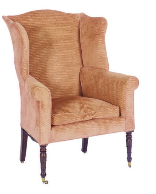 A REGENCY MAHOGANY AND UPHOLSTERED WINGBACK ARMCHAIR,