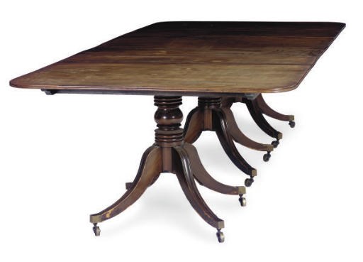 AN ENGLISH MAHOGANY TRIPLE-PEDESTAL DINING TABLE,