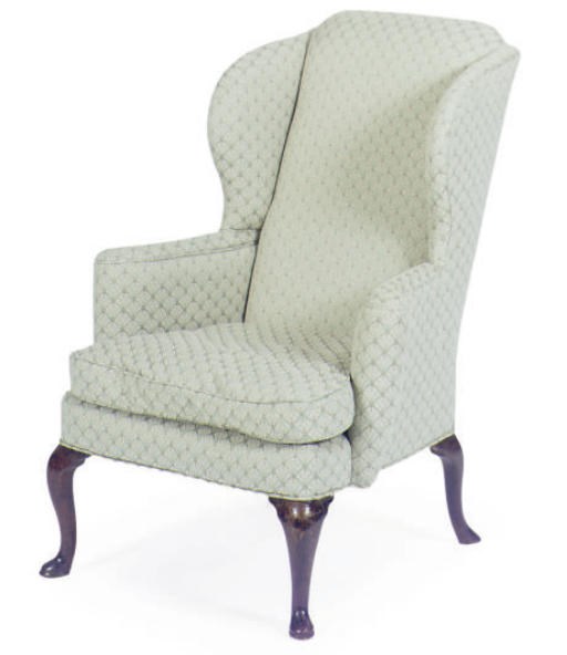 AN ENGLISH MAHOGANY AND UPHOLSTERED WINGBACK ARMCHAIR,