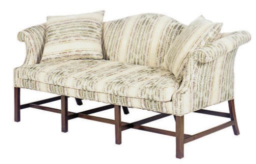 A MAHOGANY AND UPHOLSTERED CAMELBACK SOFA,
