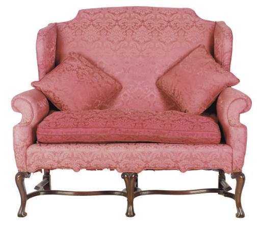 AN ENGLISH DAMASK UPHOLSTERED CARVED MAHOGANY SOFA,