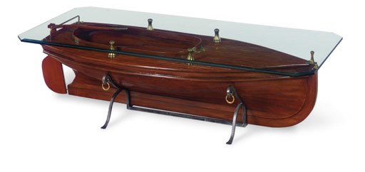 A coffee table in the form of a catboat hull