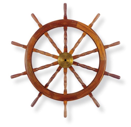 A large mahogany and maple twelve-spoke ships wheel
