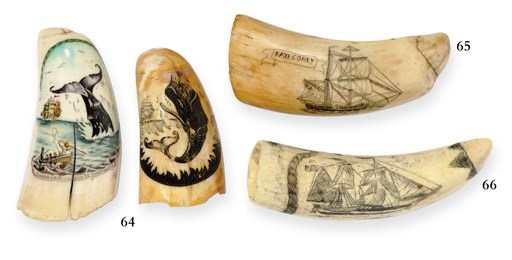 A pair of small 20th century scrimshaw whale's teeth**