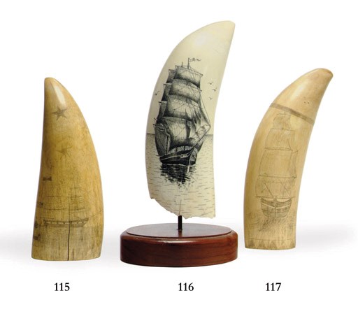A 20th century scrimshaw whale's tooth of a ship in a calm sea**