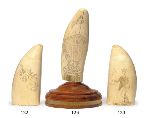 A 19th century scrimshaw whale's tooth with revelling sailors**