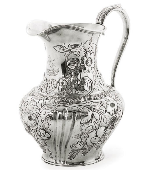 AN EARLY VICTORIAN SILVER MILK JUG