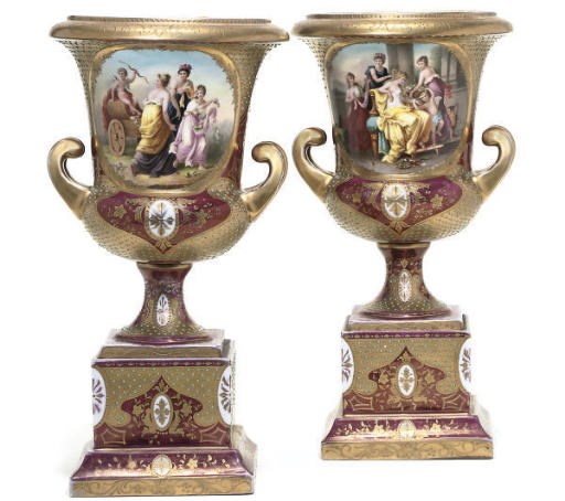 A PAIR OF VIENNA-STYLE CLARET-GROUND TWO-HANDLED CAMPANA-SHAPED VASES AND FIXED BASES