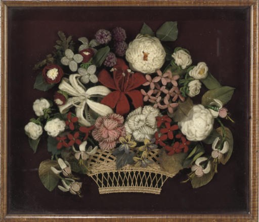 A VICTORIAN WOOLWORK EMBROIDERED COLLAGE OF A FLOWER BASKET