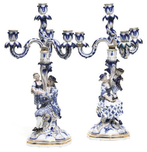 A PAIR OF MEISSEN BLUE AND WHITE FIGURAL CANDELABRA
