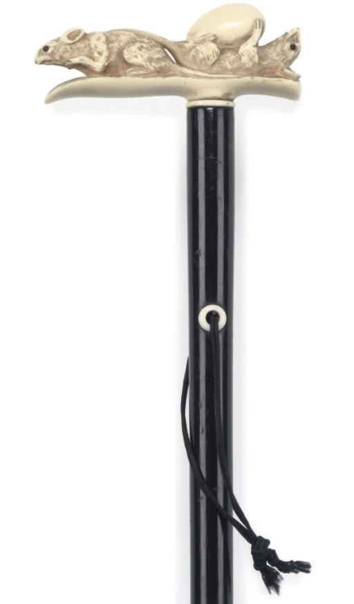 A JAPANESE CARVED IVORY AND EBONISED WALKING STICK