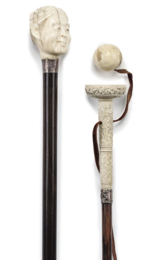 A JAPANESE CARVED IVORY MOUNTED HARDWOOD WALKING CANE