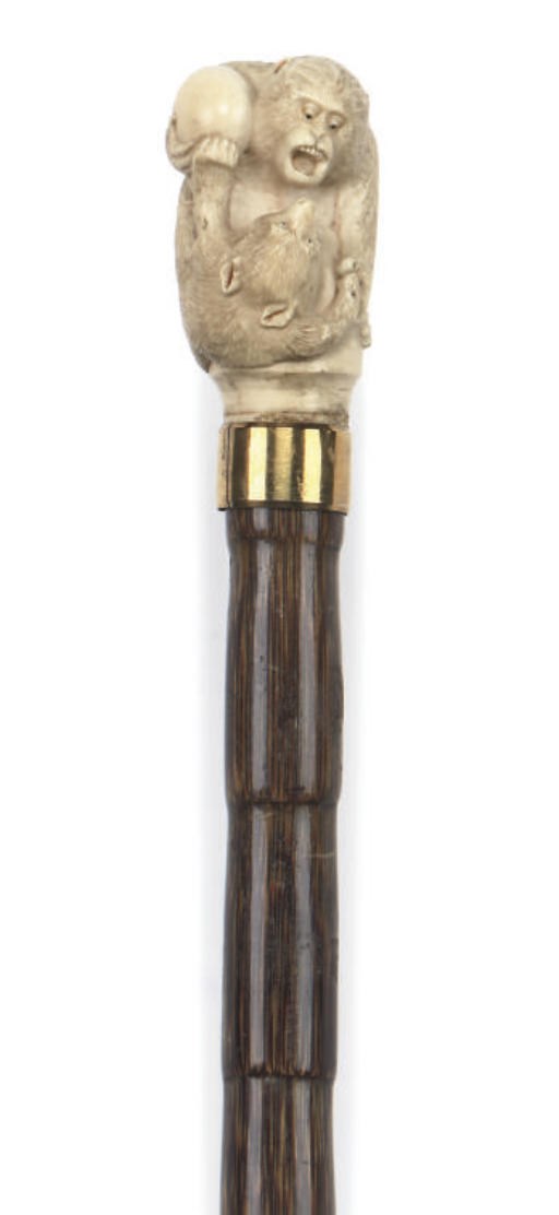 A JAPANESE CARVED IVORY MOUNTED BAMBOO WALKING STICK