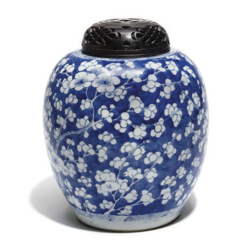 A Chinese blue and white 'prunus' jar and wood cover