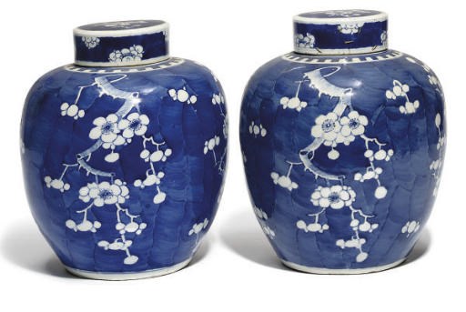 A Pair of Chinese 'Prunus' jars and covers