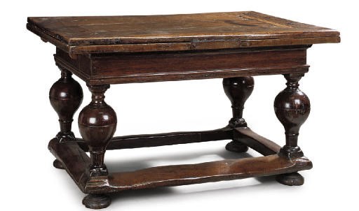 A NORTH EUROPEAN OAK EXTENDING DINING TABLE