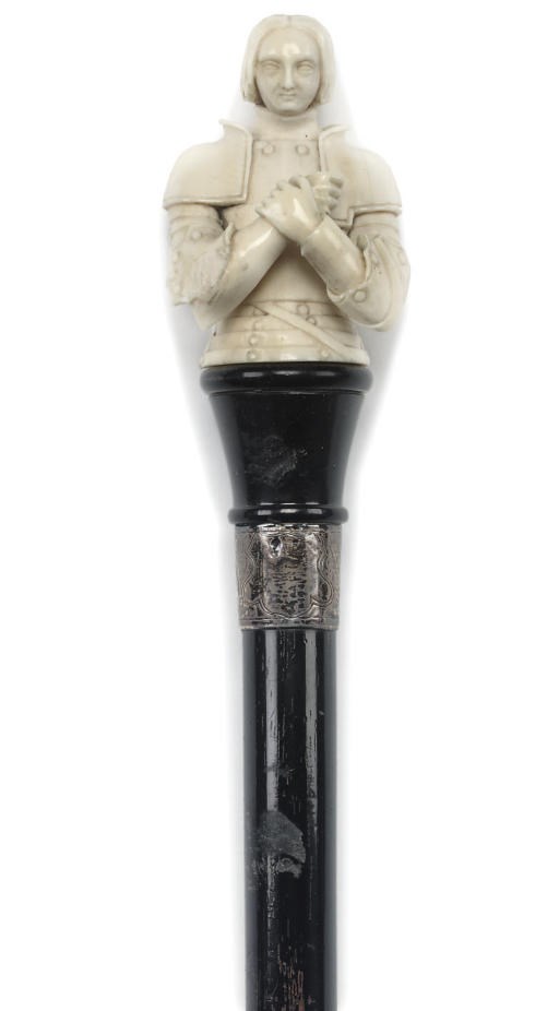 A LATE VICTORIAN CARVED IVORY AND EBONISED WALKING STICK