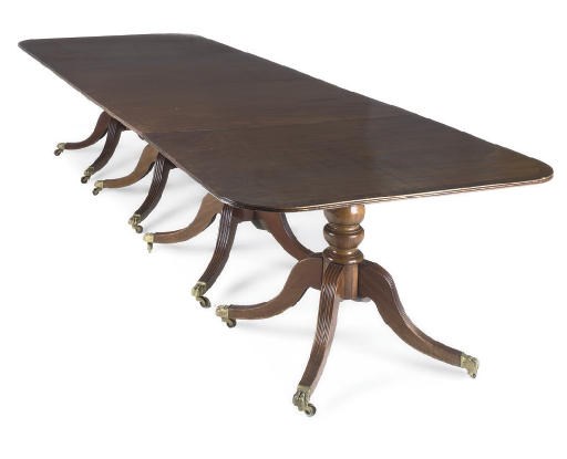 A MAHOGANY FOUR PEDESTAL DINING TABLE