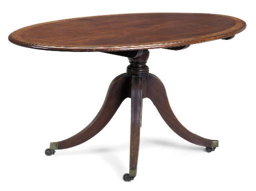 A REGENCY MAHOGANY AND BROWN OAK CROSSBANDED OVAL BREAKFAST  TABLE