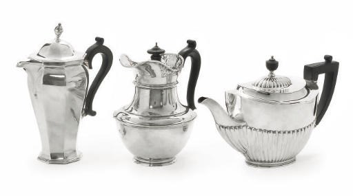 A GEORGE V HOT WATER JUG