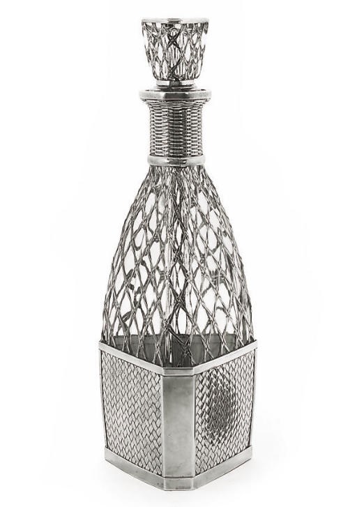 A CONTINENTAL METALWARE-MOUNTED GLASS DECANTER,