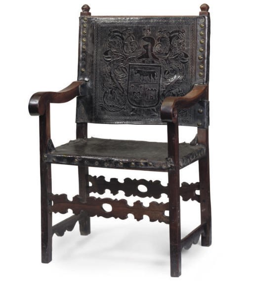 A PORTUGESE ROSEWOOD AND LEATHER UPHOLSTERED ARMCHAIR