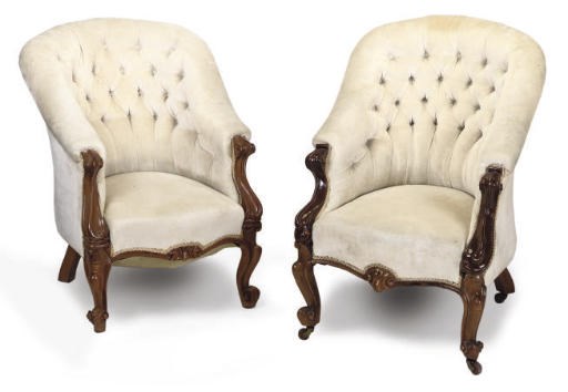 A MATCHED PAIR OF VICTORIAN WALNUT TUB CHAIRS